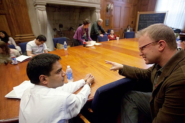 Amitabh Chandra (from left) and Jeremy Greene are two of the researchers who participated in a roundtable marking World Malaria Day. Despite the difficult challenge of eradicating malaria, panelists said that it is an aspirational goal, aimed at getting political and public action pointed at a serious worldwide problem.