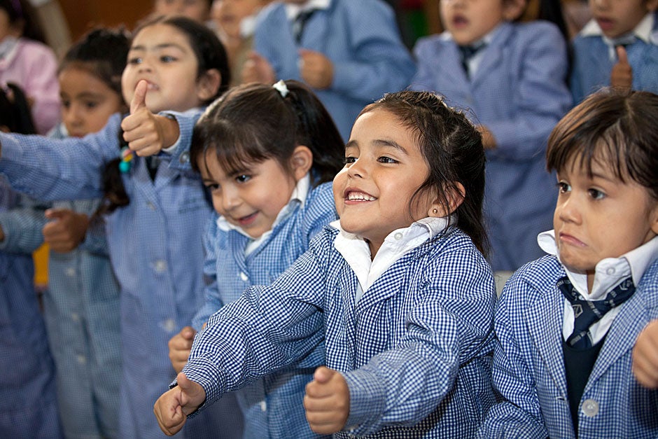 March 21, 2011. Children sing for Harvard President Drew Faust (not pictured) during her visit to a classroom that is part of the Un Buen Comienzo program in Santiago, Chile. Photo by Kris Snibbe/Harvard Staff Photographer
