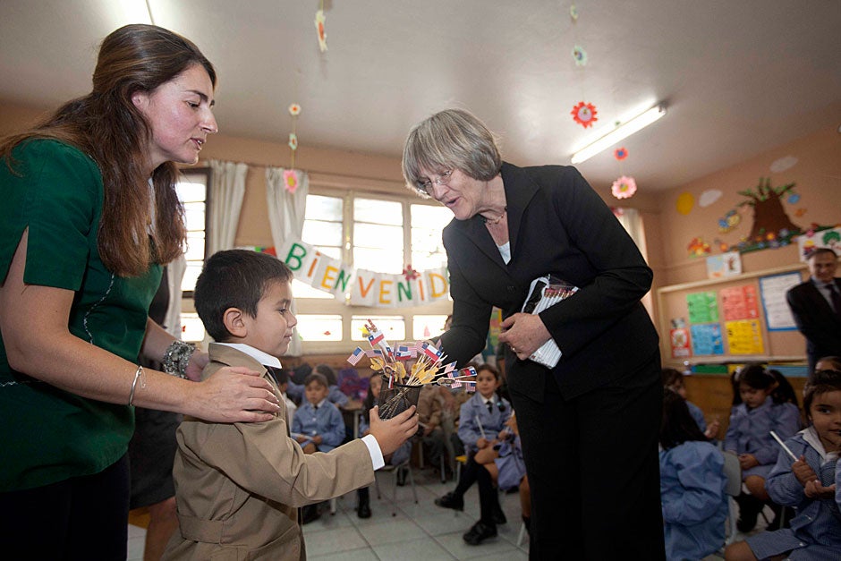 March 21, 2011. Maria Cristina Valenzuela (left) and her class welcome Harvard President Drew Faust. The classroom is part of the Un Buen Comienzo program in Santiago, Chile. Photo by Kris Snibbe/Harvard Staff Photographer