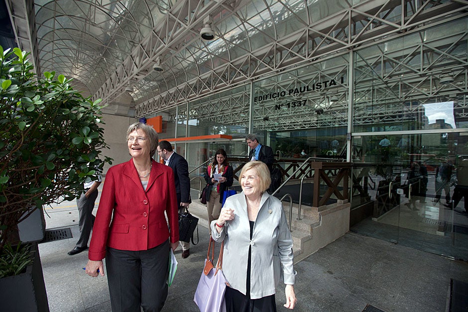 March 24, 2011. Harvard President Drew Faust (left) walks with Merilee Grindle, Edward S. Mason Professor of International Development at the Harvard Kennedy School and director of the David Rockefeller Center for Latin American Studies (DRCLAS), outside the entrance to DRCLAS’s regional office in São Paulo, Brazil. Photo by Kris Snibbe/Harvard Staff Photographer