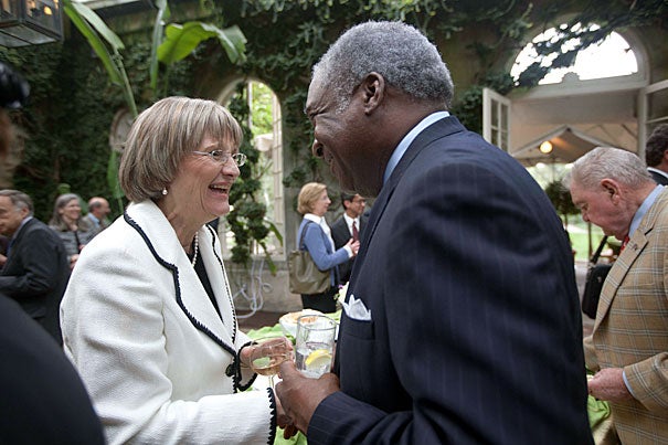 Harvard President Drew Faust speaks with Walter Morris '73, M.B.A. '75, during a reception at Dumbarton Oaks. 