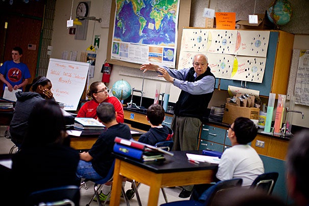 Dick Post, retired businessman and ambassador in the Worldwide Telescope Ambassadors Program — the brainchild of astronomy Professor Alyssa Goodman — works with students at Clarke Middle School in Lexington on projects the kids made using an astronomy software by Microsoft.
