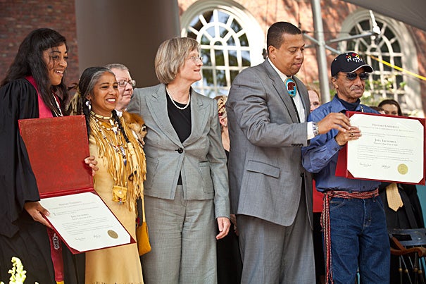 Tiffany Smalley '11 (far left) receives a special posthumous degree on behalf of Joel Iacoomes, Harvard College Class of 1665, during Commencement on May 26. Also present were Cheryl Andrews-Maltais (second from left), chairwoman of the Wampanoag Tribe of Gay Head (Aquinnah), President Drew Faust, Cedrick Cromwell, and Bernard Coombs.
