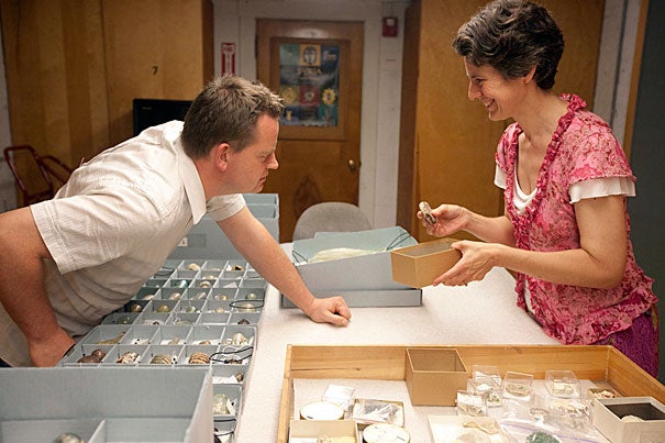 Patrick Degryse and Katherine Eremin examine Nuzi glass in the Semitic Museum's collections. The researchers are investigating the properties of ancient glass and other materials to understand more about where and how they were manufactured and what the background says about their makers.