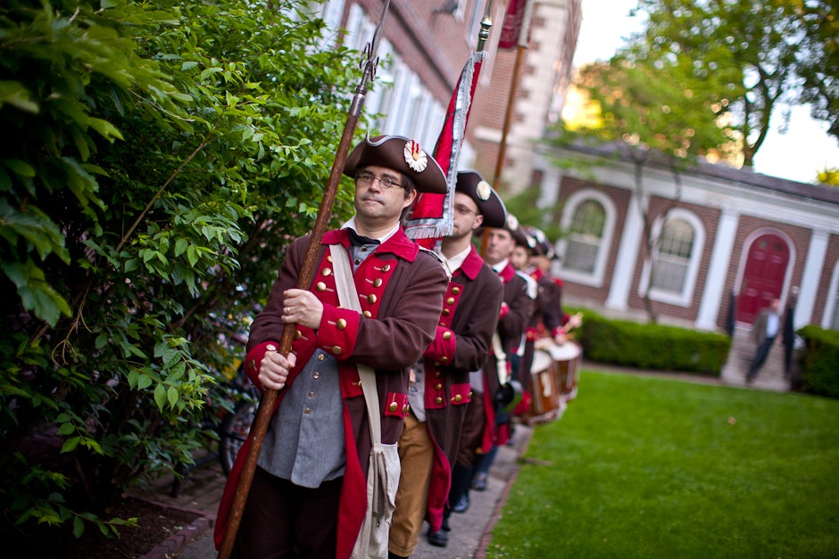 Members of the Bedford Minuteman group raise the alarm and wake students at Kirkland House as Harvard celebrates Commencement 2011. Justin Ide/Harvard Staff Photographer