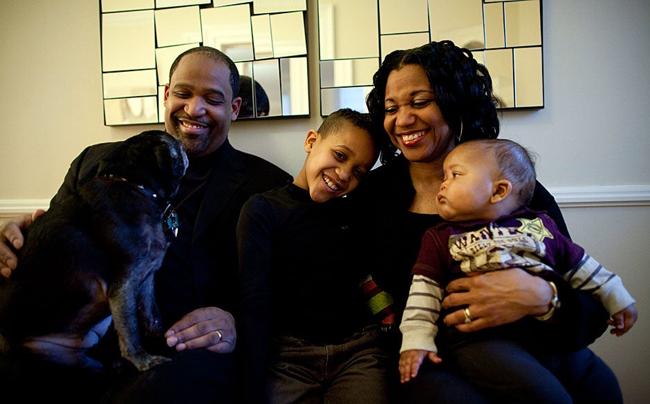 The center of Winthrop House activity and spirit resides in the House masters’ suite with Harvard Law School Professor Ronald Sullivan Jr. and Harvard Law School Lecturer Stephanie Robinson, their sons Trey and Chase (right), and their dog Nietzsche. Sullivan and Robinson made history when they were appointed the first African-American House masters at Harvard in 2009. Stephanie Mitchell/Harvard Staff Photographer