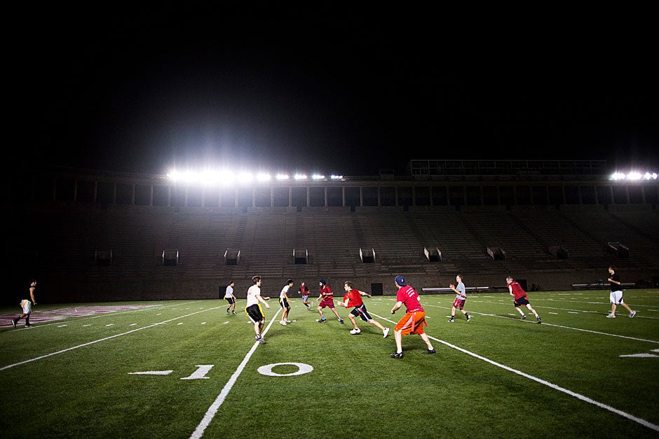 The stands at historic Harvard Stadium are empty, the vacant seats and aisles a dim reminder of the raucous crowds at major football games like Harvard-Yale. But most evenings, there is still plenty of action on the field — like the battle for the Straus Cup, where Winthrop House stands as the most formidable contestant. Stephanie Mitchell/Harvard Staff Photographer