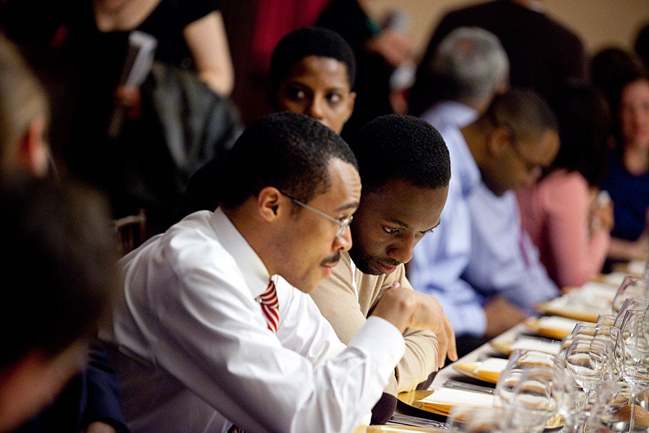 Harvard Law School student Milton Wilkins (left) and Jamie Hector, the actor who played Marlo Stanfield, speak during the dinner. Stephanie Mitchell/Harvard Staff Photographer