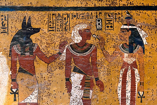 The south wall of Tutankhamen's tomb shows Hathor, goddess of the west, welcoming the pharaoh into the underworld. The embalmer god, Anubis, stands behind the king. 