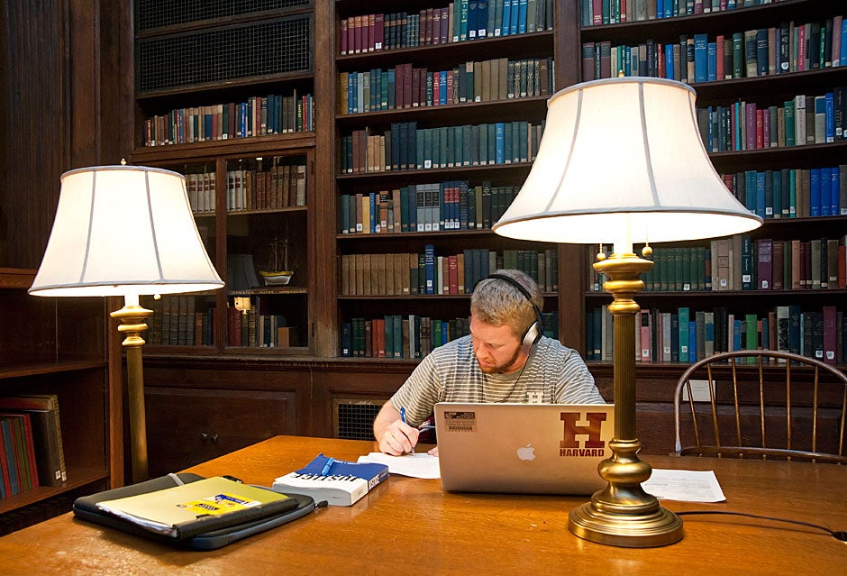 Garrett Barnard '13 finds some solitude for studying in the Dunster library on a weeknight. Jon Chase/Harvard Staff Photographer