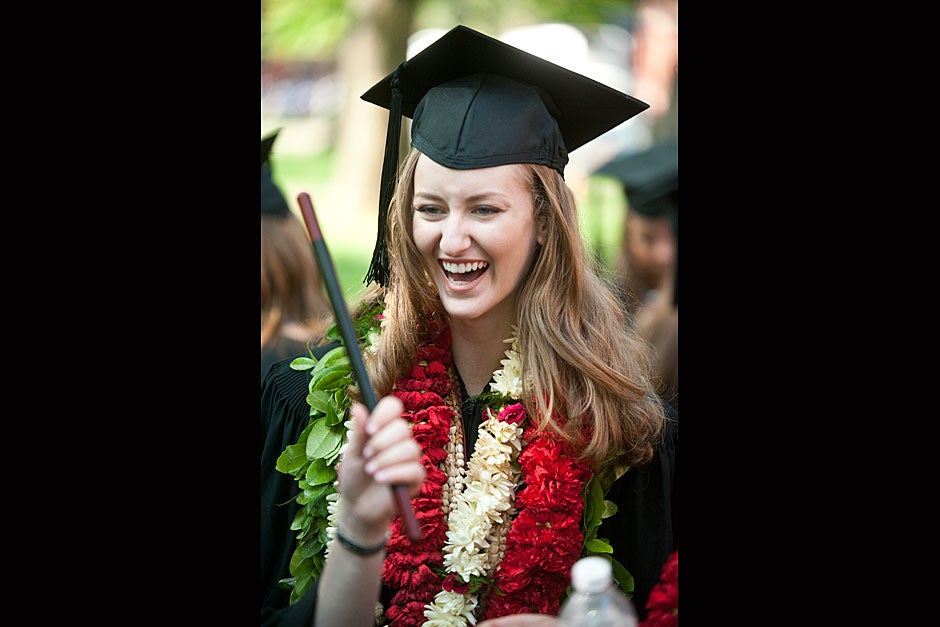 Dunsterite Zoe Morrison '11, who hails from Hawaii, sports a lei at Commencement’s Morning Exercises. Jon Chase/Harvard Staff Photographer