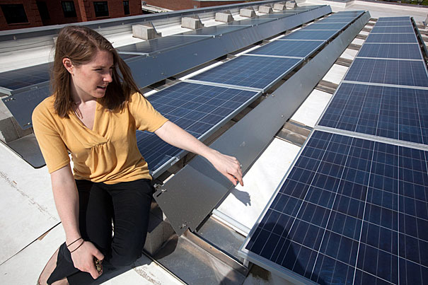HGSE project manager and Green Team member Linda Kuczynski shows off solar panels on the roof of the Gutman Library. Other targeted initiatives at the School include a printer cartridge recycling program, a cosmetics drive, bike rack improvements, and, coming soon, single-stream recycling and public composting.