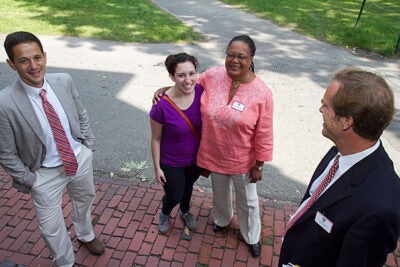 Evelynn M. Hammonds (center right), dean of Harvard College, offered a warm welcome to Amalia Duncan '15. Dean of Freshmen Thomas A. Dingman (far right) Ben Castleman, (far left) were also on hand as the Class of 2015 streamed into Harvard Yard on Thursday.