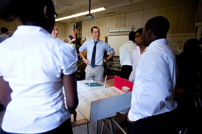 Graduate School of Education student Jeremy Jackson (center), who studied engineering and design prior to enrolling at Harvard, helped the students with their intricate layouts and floor plans. “It was my first time ever teaching,” he said. “So I learned a lot because we were just thrown into the mix.” 
