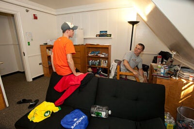 “It’s cool,” Tom Keefe '15 (left) said of his new abode. “There are only 14 kids, there’s amazing history, and we are on the top floor.” He and new roommate George Doran '15 already had bonded over common interests, including a Nintendo 64 video game and the need for a tall floor fan, which they purchased right after they moved in.
