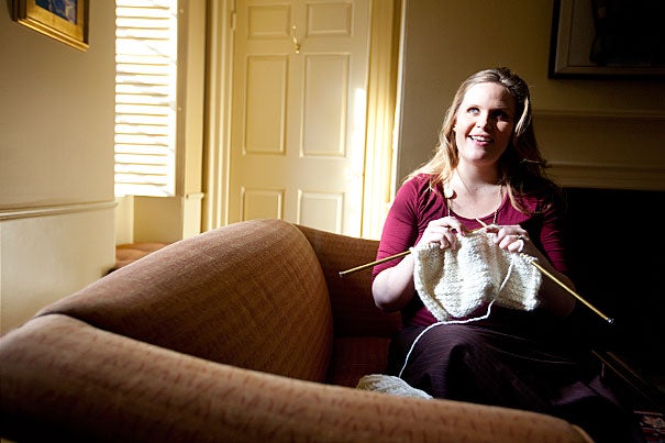 Marie Dach, executive assistant to the provost and a resident tutor in Pforzheimer House, leads a weekly knitting circle, and its proceeds benefit local homeless and women's shelters. 