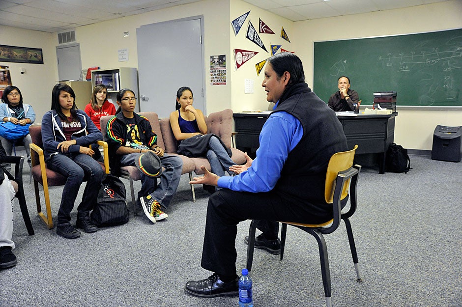 After briefly describing Harvard College to students at Bernalillo High School, Packineau speaks about the difficulty that native people have in leaving home, as he tries to prepare them for a possible giant leap from New Mexico to Cambridge or some other distant university destination. Jon Chase/Harvard Staff Photographer