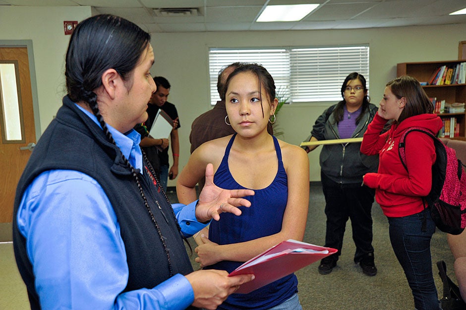 Jason Packineau speaks with a particularly motivated Bernalillo student who has brought her transcript for him to assess. Two students from Bernalillo have previously attended Harvard. Jon Chase/Harvard Staff Photographer