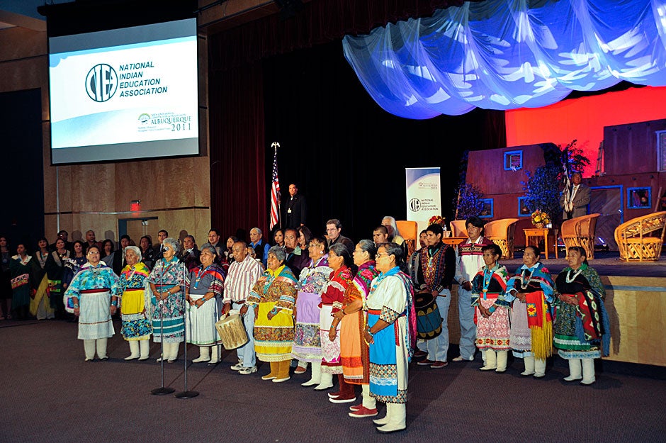 Singers and dancers perform in traditional formal clothing at the opening ceremonies of the National Indian Education Association (NIEA) conference. Jon Chase/Harvard Staff Photographer