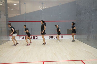 The men’s and women’s squash teams are as yet undefeated, winning their last nine and seven matches, respectively. “We’ve been training really hard,” said women's co-captain Nirasha Guruge (far right).