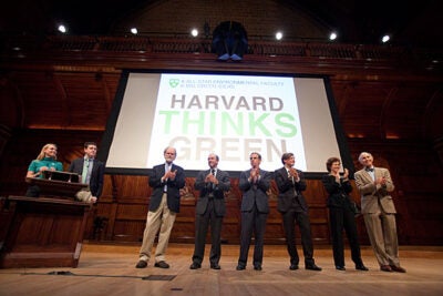At the first Harvard Thinks Green, six Harvard professors gathered at Sanders Theatre to provide just that kind of thinking. They included Eric Chivian (from right), Rebecca Henderson, Christoph Reinhart, Robert Kaplan, Richard Lazarus, and James McCarthy. Hosting the event were Office for Sustainability Director Heather Henriksen (far left at podium) and event co-founder Peter Davis '12.