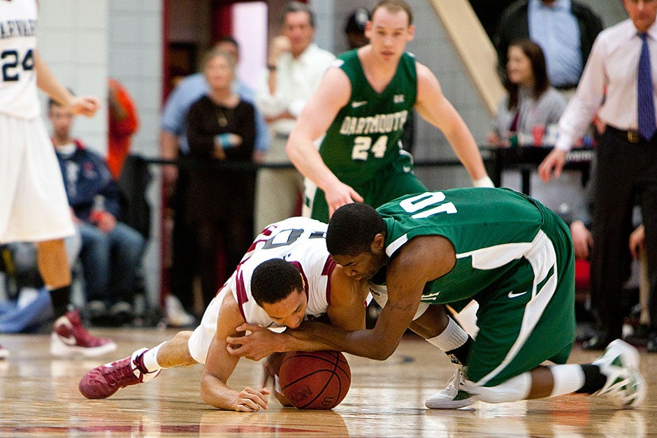 Harvard’s Brandyn Curry (left) fights for a loose ball. Rose Lincoln/ Harvard Staff Photographer