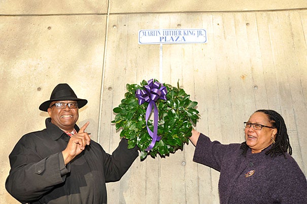 Acting Cambridge Mayor Kenneth E. Reeves (left) and Harvard College Dean Evelynn M. Hammonds lay a wreath to commemorate Martin Luther King Jr. Day at the Cambridge Public Library. In her keynote address, Hammonds called for educators to help students “make explicit their own values and build their own ‘beloved communities.’ ”