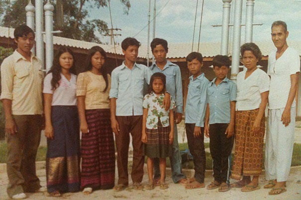 From a Thai refugee camp, Aun Em's family was brought in 1982 to New York state under church sponsorships. “It was challenging for us, but we knew we were not in fear of being taken away,” Em said (little girl, front). “We were happy to be in America. We needed to learn how to adapt.”