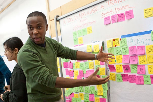 Siyabulela Xuza ’12, an engineering sciences concentrator, explains his team's project, a tool kit to ease the transition from high school to college. 