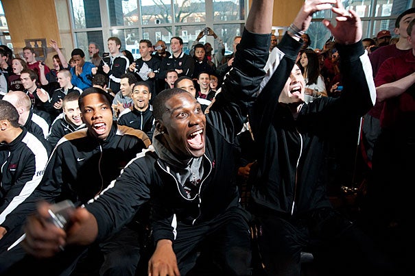 The Harvard men's basketball team watches the selection announcement for the NCAA Tournament at the Murr Center. Harvard was seeded 12th in the East tournament bracket, and will play Vanderbilt in Albuquerque, N.M., on Thursday. 
