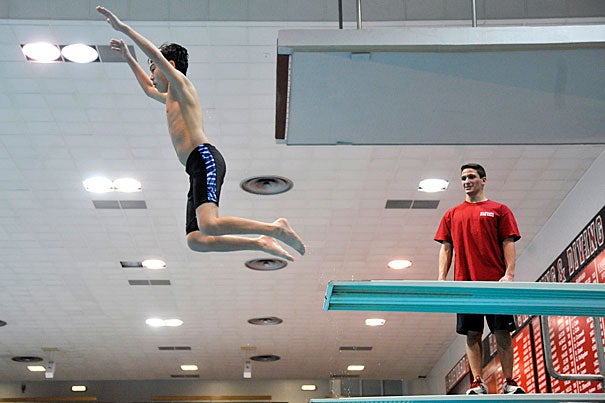Diver and Olympic qualifier Mike Mosca ’15 oversees burgeoning diver Thomas Choy, 15. 