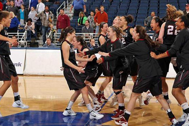 Harvard women's basketball celebrates its win over Hofstra, 73-71 on Thursday. The Ivy League entered this year's tournament a combined 0-5 in the WNIT since 2007 when it first earned an automatic bid. For Harvard, it marks the team's first victory in three tries at the tournament and improves the program to 2-8 all-time in the postseason.