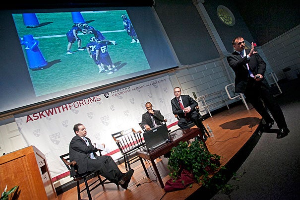 Askwith Forum panelists Andy Rotherham (from left), Domonique Foxworth, Tim Daly, and Brendan Daly discussed lessons for educators in the ways NFL teams prepare for games and evaluate talent. 
