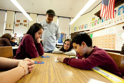Garden Pilot Academy fourth-graders Jade Diaz (far left) and Sebastian Alvarez (far right) were joined by Harvard Graduate School of Education's Alfonso Herrera (standing) and Nell Hutchins during Family Math Night.
