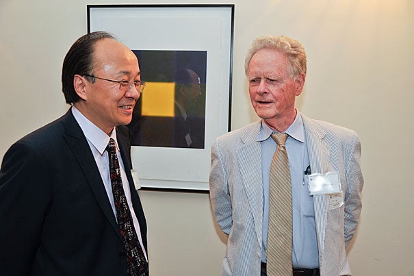 Xiao-Li Meng (left), Whipple V.N. Jones Professor of Statistics, speaks with Professor Arthur P. Dempster before the event that celebrated the inauguration of the Arthur P. Dempster Award and the 55th anniversary of the Harvard Statistics Department.