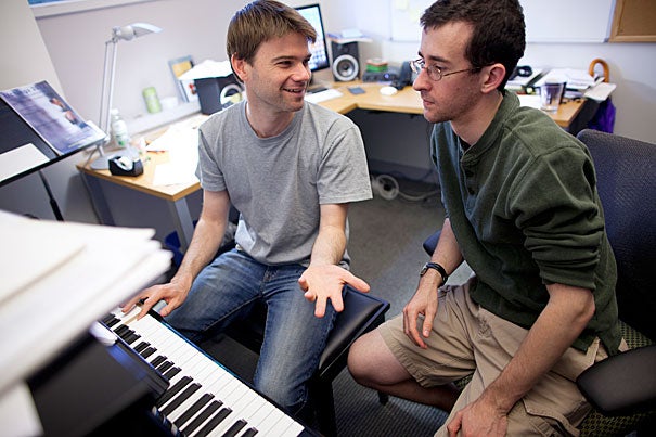 Harvard junior and musician Zach Sheets (right) has been working with composer and Radcliffe Fellow John Aylward, who is helping Sheets learn a new software for composition while giving him pointers for composing. 