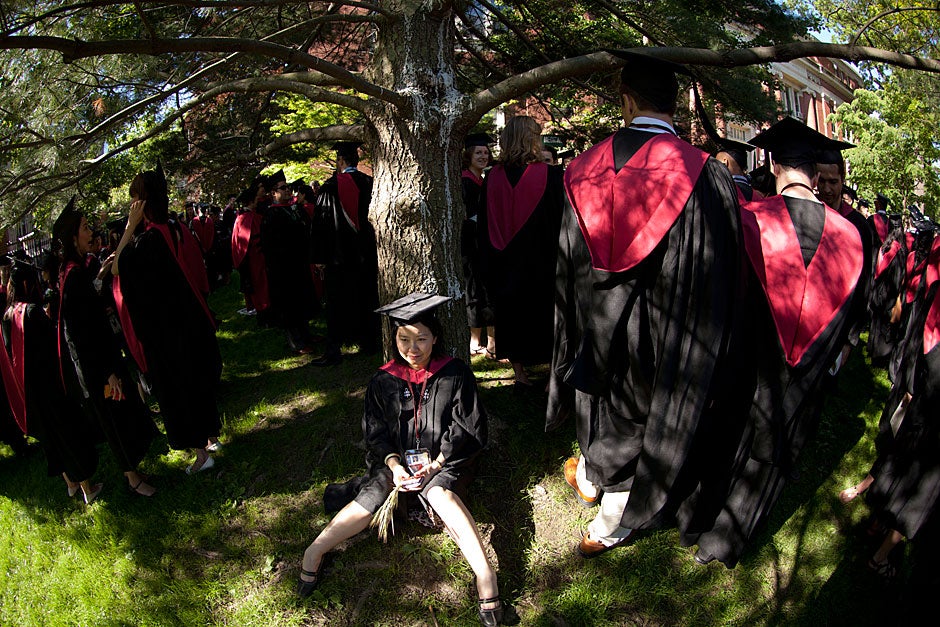 Lin Wang, Harvard Extension School A.L.M. ‘12, rests before processing at the beginning of the day. Kris Snibbe/Harvard Staff Photographer