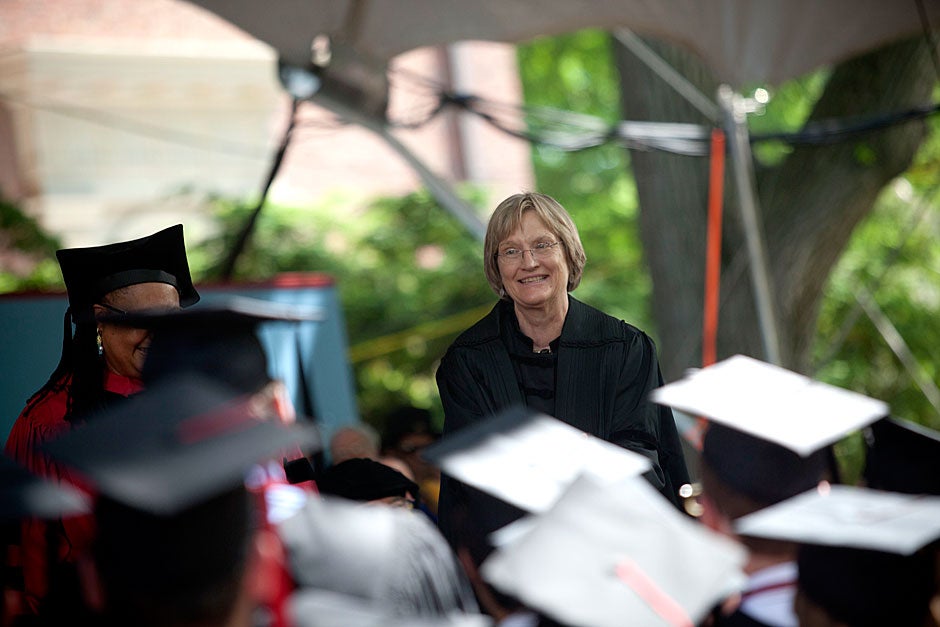 Harvard President Drew Faust congratulates Phi Beta Kappa undergraduates as they approach the stage during their degree conferment. 
Kris Snibbe/Harvard Staff Photographer
