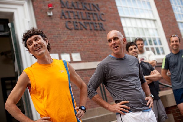Nearly 80 runners joined authors and fitness authorities Scott Jurek (left) and Christopher McDougall ’85 for a run along the Charles, an event sponsored by Harvard On The Move.