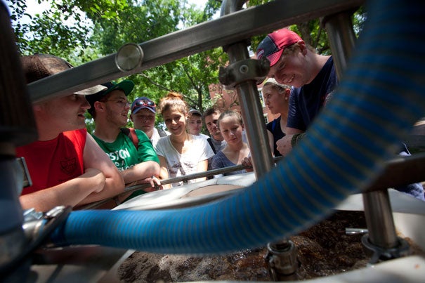 Norfolk County Agricultural High School students watch the brewing of organic fertilizer "tea" by Harvard Landscape Services during a visit to Harvard Yard. The field trip was part of a four-week program in partnership with the Arnold Arboretum.