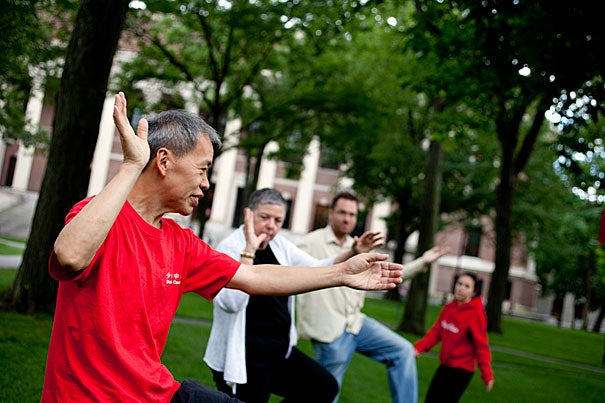 Yon Lee (left) is offering free, outdoor tai chi lessons in Harvard Yard on Tuesday afternoons through the summer and into the fall as part of the University's emphasis on revitalizing common spaces.