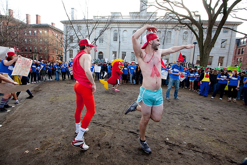 Dan Bruder '12 (from left) and Seth Pearce '12 do ballet in the Yard on Housing Day, an annual tradition where all the upperclassmen meet in the Yard to wake up the freshmen and tell them which House they will live in the following three years. Rose Lincoln/Harvard Staff Photographer