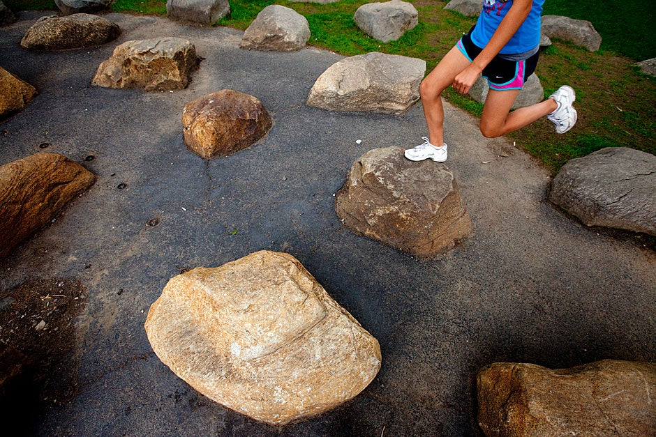 Circles of rocks outside the Science Center at Harvard are an irresistible place to jump. Rose Lincoln/Harvard Staff Photographer