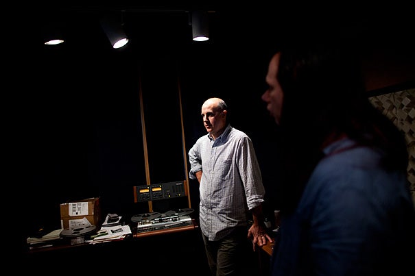 Audio engineers work in Harvard’s Audio Preservation Studio with its tape decks, turntables, and computers. Media technician Darron Burke (left) and David Ackerman (right), who directs Harvard’s high-tech audio studio, have digitized field recordings made in the 1930s on aluminum discs. 