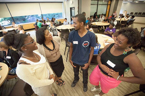 Discussing the benefits of Harvard’s summer jobs program are Thelora Marseille (from left), who this fall will attend the University of Massachusetts, Boston; Lisa Maxwell, assistant director of employment at HGSE; Tewodrose Woldemariam, who will attend Regis College; and Eunice Offre, who is bound for Colby-Sawyer College.
