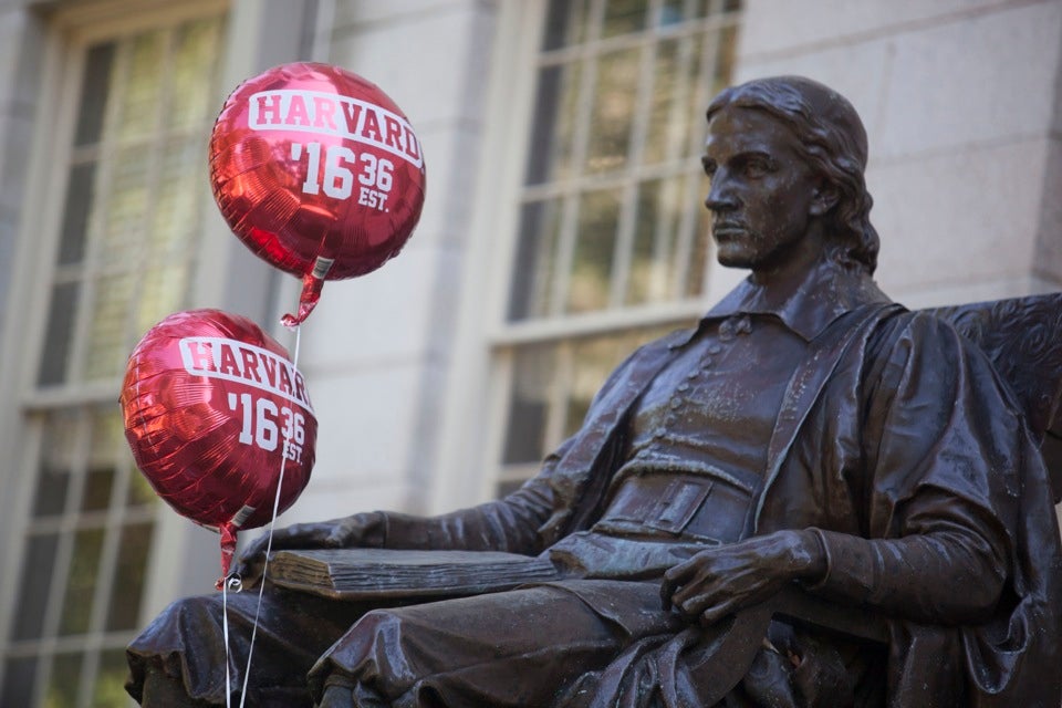 What would John Harvard think of it all?  Not even balloons can break his permanently stoic face.
