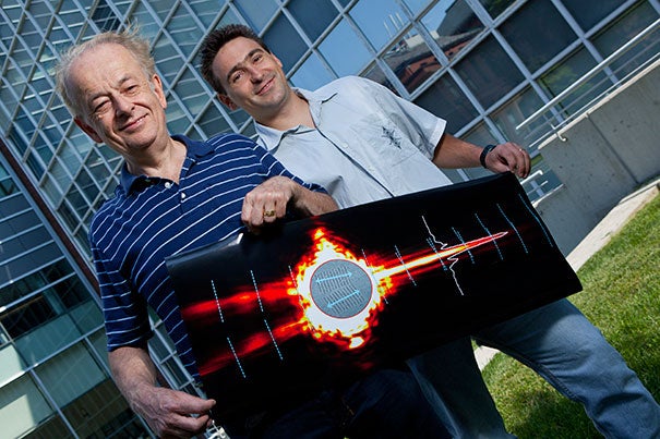 Federico Capasso (left), Patrice Genevet (right), and an international team of colleagues have demonstrated a new type of tightly controlled light wave that could eliminate signal loss in on-chip optical devices. 