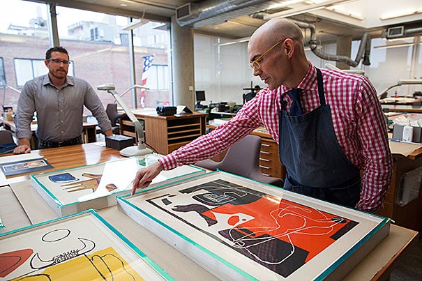 Paper conservators at the Weissman Preservation Center Adam Novak (left) and Christopher Sokolowski recently helped assess, repair, and reframe six Le Corbusier lithographs and one proof print from a Joan Miró etching. The artworks, most of them about 50 years old, came from the Carpenter Center for the Visual Arts. 