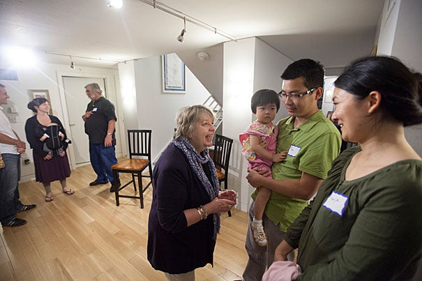 Doreen Hogle (from left), co-master of Dudley House, meets with Peabody Terrace residents Claire Zou, 2, GSAS graduate student Ge Zou, and Yunjie Peng. 