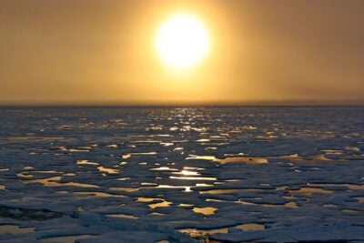 Sunset in the Arctic: A new study at Harvard explores the feasibility of using cautious and targeted solar geoengineering to counter the loss of Arctic sea ice. 